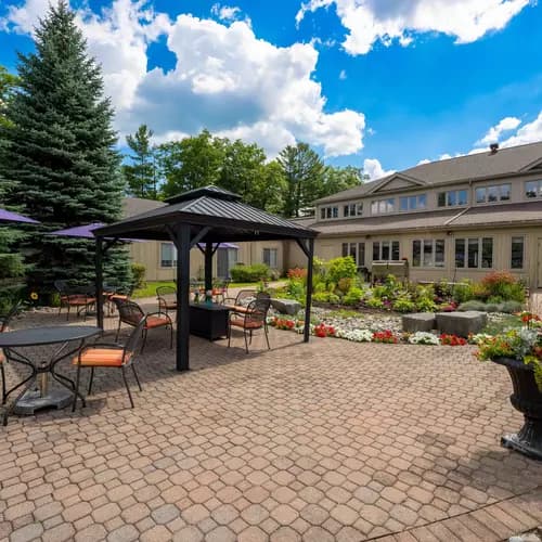 Patio and walking paths at Chartwell Whispering Pines Retirement Residence.