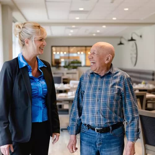 Chartwell Staff showing around the residence to a senior