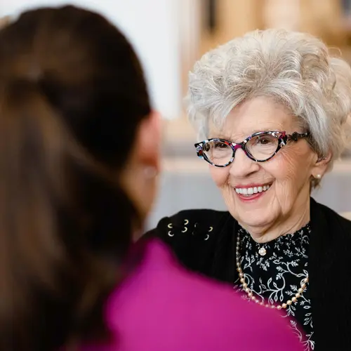 Chartwell staff chatting with the senior resident