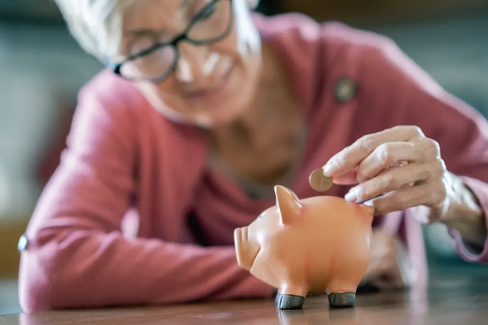 senior-lady-piggy-bank 2