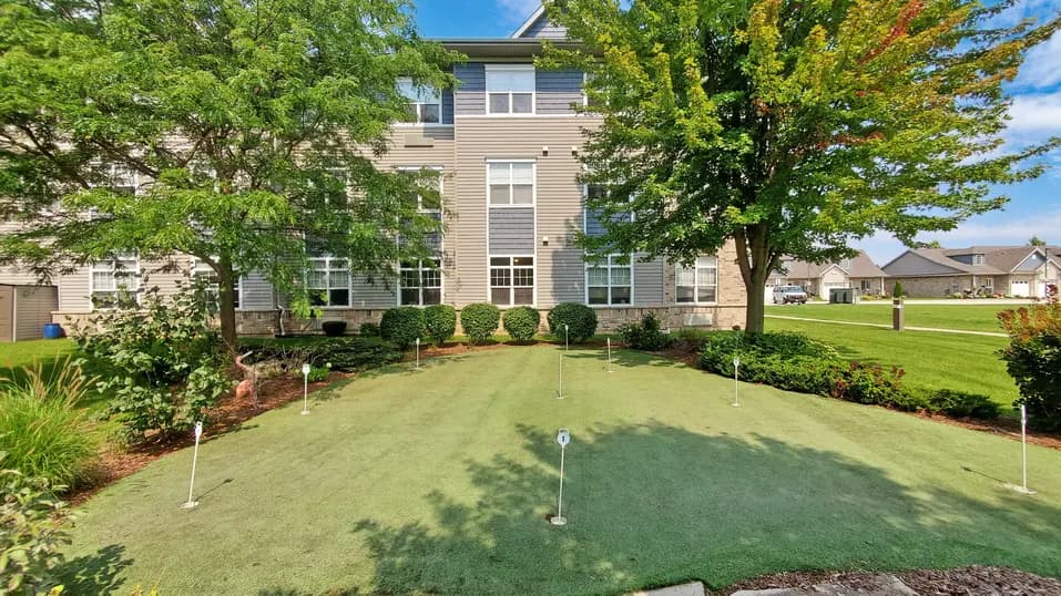 Golf area with exterior of building at Chartwell Royal Oak Village