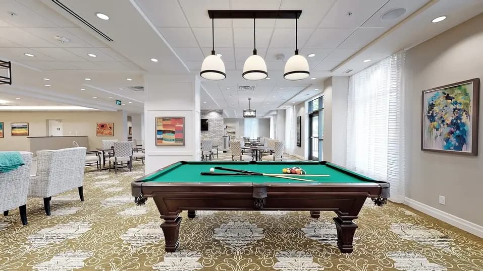 Common space area with pool table at Chartwell Fraser Terrace