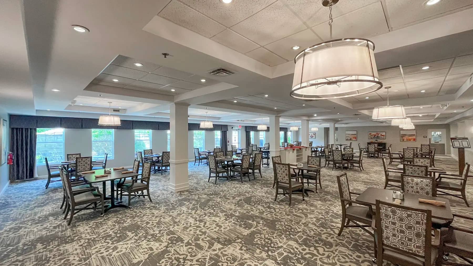 Full view of dining room with table and chairs at Chartwell Dufferin Centre