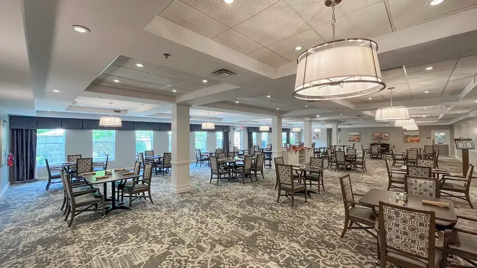 Full view of dining room with table and chairs at Chartwell Dufferin Centre