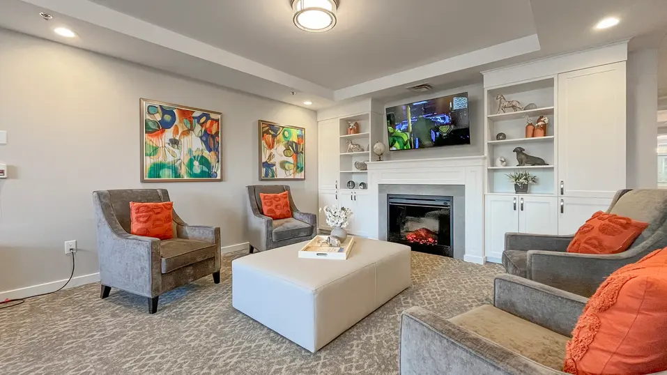 Lounge room with chairs and tv at Chartwell Dufferin Centre