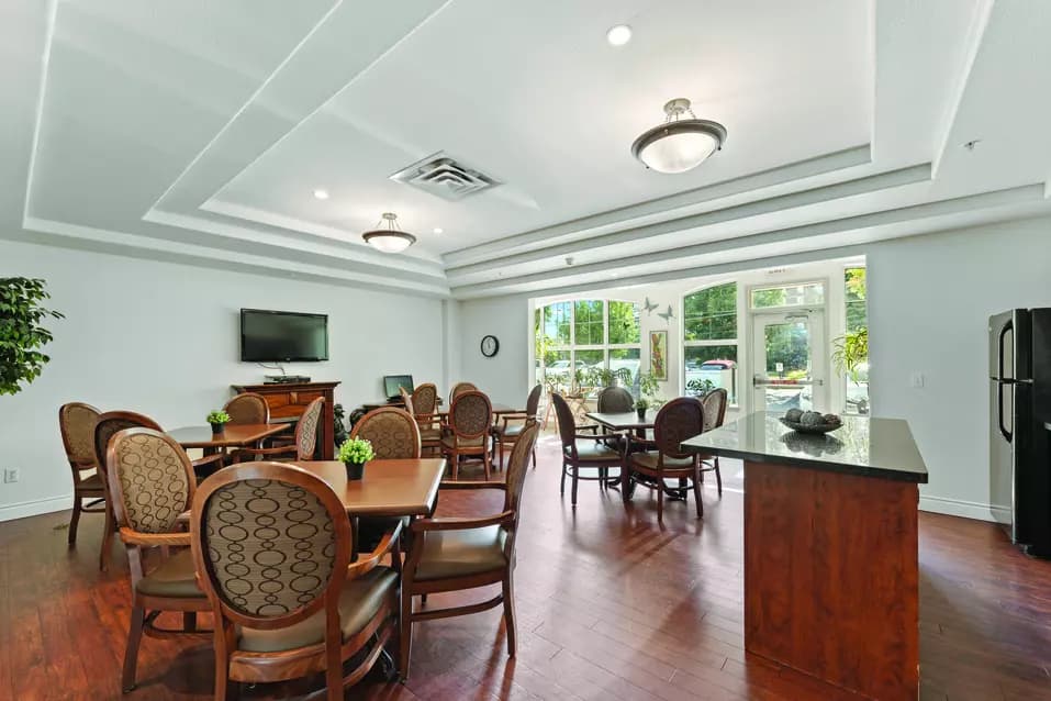 Chartwell Regency Retirement Residence bistro with tv and seating