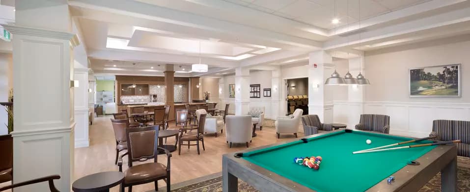 Billiards room and seating at Chartwell Waterford Retirement Residence
