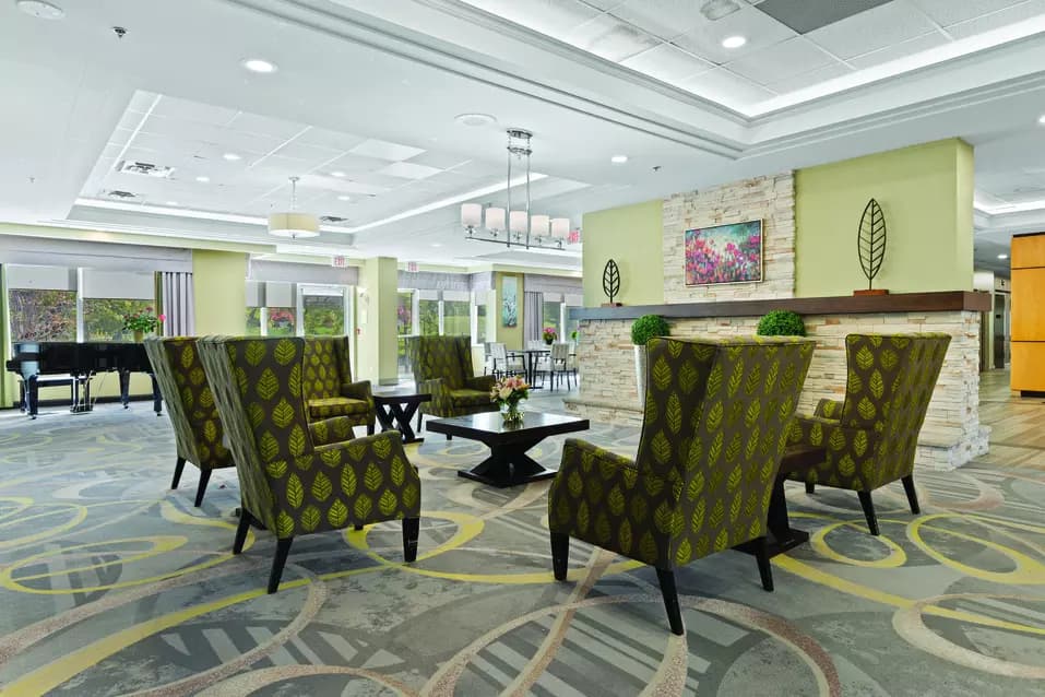 Fireplace lounge at Chartwell Scarlett Heights Retirement Residence