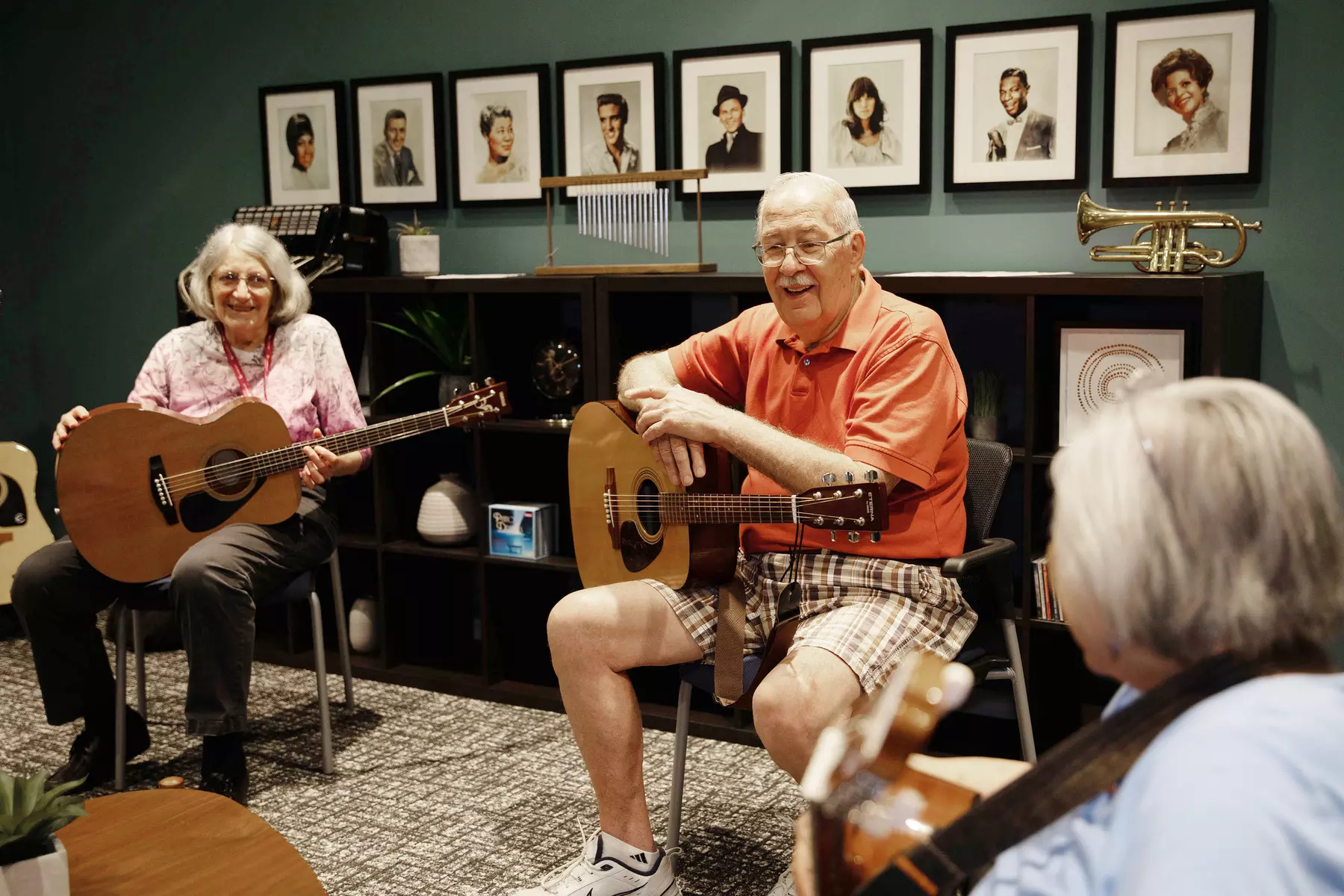 Senior resident group getting ready to play guitar
