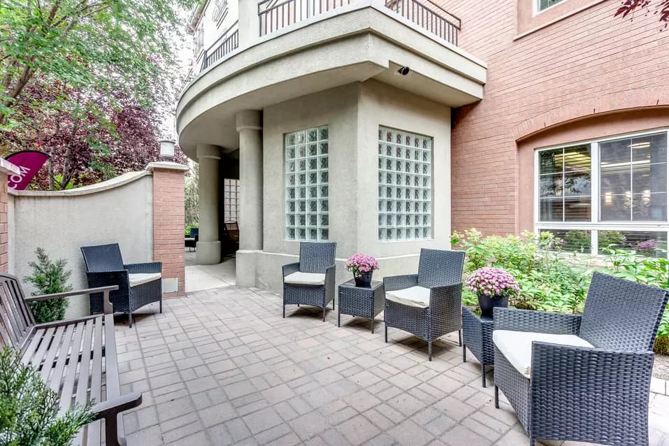 interlocked courtyard patio with seating at chartwell fountains of mission retirement residence
