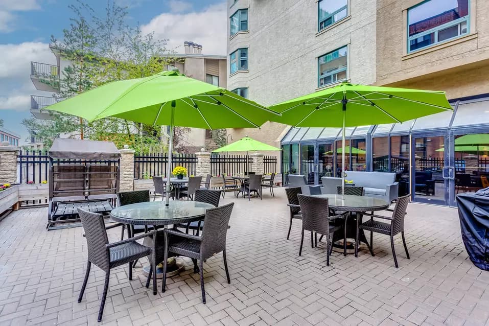 colourful courtyard at chartwell eau claire care residence