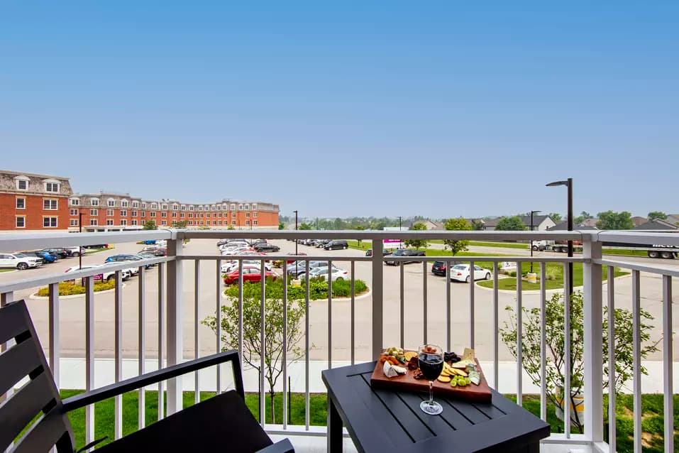 chartwell montgomery village, balcony, suite, wine glass, cheese, crackers, parking lot