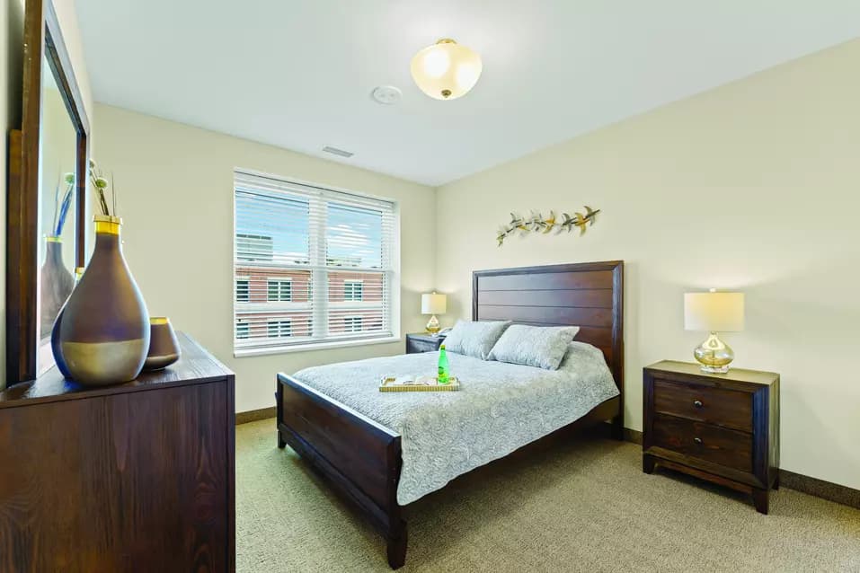 Chartwell Allandale Station Retirement Residence bedroom with big windows.