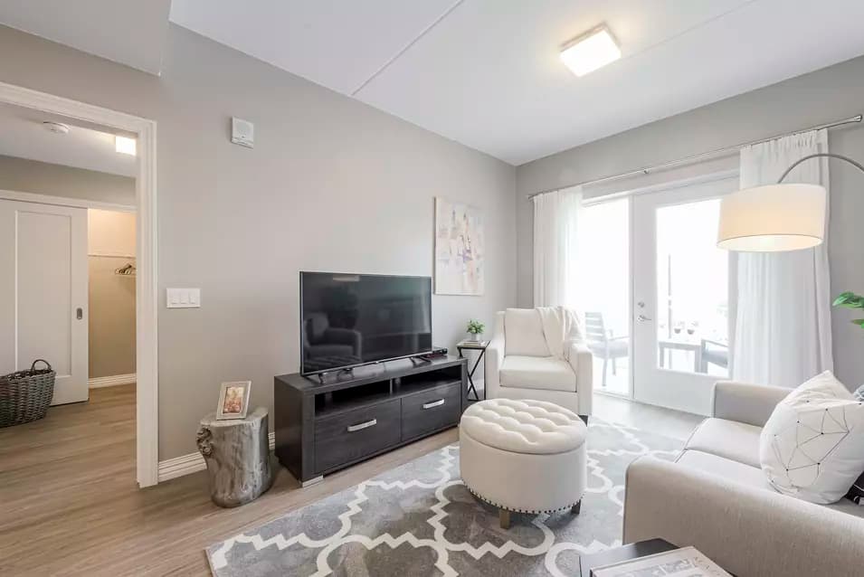 chartwell montgomery village, suite, sofa, tv, living room