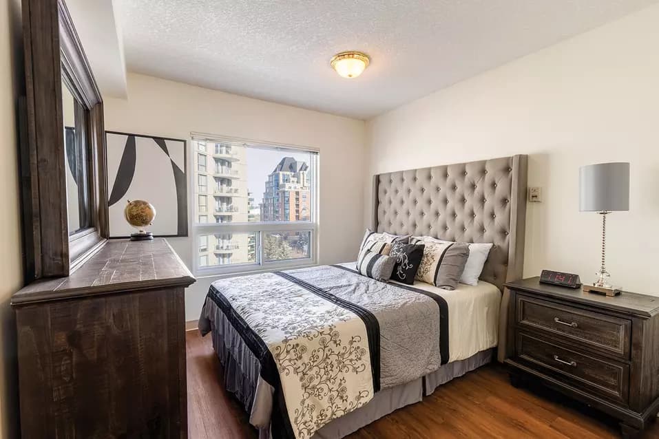 comfortable bedroom with excellent city views at chartwell eau claire care residence