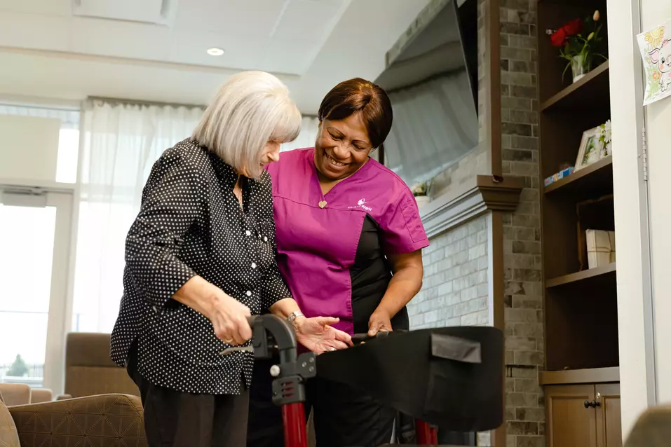 Chartwell Care staff helping the senior resident walking